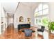 Well-lit living room with hardwood floors and arch window view at 9790 Summerlakes Dr, Carmel, IN 46032