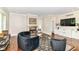 Cozy living room featuring hardwood floors, fireplace, and built-in shelving at 9790 Summerlakes Dr, Carmel, IN 46032