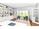 Bright office space featuring built-in shelving and hardwood floors at 9790 Summerlakes Dr, Carmel, IN 46032