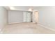 Open room with neutral walls and carpet, offering versatile space and multiple closet storage options at 9790 Summerlakes Dr, Carmel, IN 46032