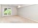 Well-lit room features neutral carpet, french doors and ample space for various living arrangements at 9790 Summerlakes Dr, Carmel, IN 46032