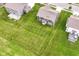 Aerial view of a home with a large, well-manicured lawn at 9860 Gallop Ln, Fishers, IN 46040