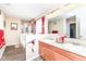Bright bathroom with double vanity, shower and tub at 9860 Gallop Ln, Fishers, IN 46040