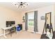 Study bedroom with a white desk, futon, and full-length mirror at 9860 Gallop Ln, Fishers, IN 46040