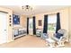 Cozy Bedroom features a white crib, comfortable glider, and fun, space-themed decor at 9860 Gallop Ln, Fishers, IN 46040