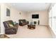 Comfortable living room with plush leather sofas, fireplace, and a cozy ambiance for relaxation at 9860 Gallop Ln, Fishers, IN 46040