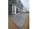 A stylish gray stamped concrete patio extends from this home's sliding glass doors, perfect for outdoor entertaining at 9860 Gallop Ln, Fishers, IN 46040