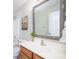 Cozy bathroom featuring a decorative mirror, stylish vanity, and neutral color scheme at 10075 Niagara Dr, Fishers, IN 46037