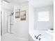 Bright bathroom with a soaking tub, a glass-enclosed shower, and fresh neutral decor at 10075 Niagara Dr, Fishers, IN 46037