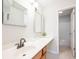 Well-lit bathroom showcasing a single sink vanity and mirror with a view of the tub/shower at 10075 Niagara Dr, Fishers, IN 46037