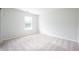 Bright bedroom with neutral carpet, a window, and an electrical outlet at 10075 Niagara Dr, Fishers, IN 46037