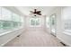 A bright bedroom boasts natural light from multiple windows and neutral carpeting at 10075 Niagara Dr, Fishers, IN 46037