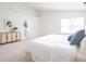 Serene bedroom with a comfortable bed, soft lighting, and a view of the doorway leading to another room at 10075 Niagara Dr, Fishers, IN 46037