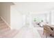 Bright hallway that leads to a carpeted staircase and open concept living area at 10075 Niagara Dr, Fishers, IN 46037