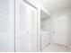 Functional laundry area with washer, dryer, shelving, and convenient closet space at 10075 Niagara Dr, Fishers, IN 46037