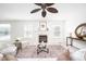 Inviting living room featuring a fireplace, comfortable seating, and a stylish decor with ample natural light at 10075 Niagara Dr, Fishers, IN 46037