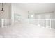 Spacious loft area with abundant natural light and views of the rooms below, showcasing an open design at 10075 Niagara Dr, Fishers, IN 46037