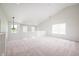 Large and airy loft featuring neutral carpet, abundant natural light, and views of the room below at 10075 Niagara Dr, Fishers, IN 46037