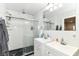 Modern bathroom features dual vanities and an oversized walk-in shower with glass door at 1043 N Beville Ave, Indianapolis, IN 46201
