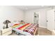 Bright bedroom featuring wood floors and ensuite bathroom for added convenience at 1043 N Beville Ave, Indianapolis, IN 46201
