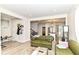 Open-concept living area with hardwood floors and seamless flow into the kitchen at 1043 N Beville Ave, Indianapolis, IN 46201