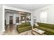 Spacious living room features hardwood floors, neutral paint, and open floor plan at 1043 N Beville Ave, Indianapolis, IN 46201