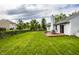 Expansive backyard featuring a well-maintained lawn and a cozy wooden deck, perfect for outdoor relaxation at 10551 Huckleberry Ct, Noblesville, IN 46060