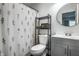 Stylish bathroom featuring modern fixtures, a floral shower curtain, and a gray vanity at 10551 Huckleberry Ct, Noblesville, IN 46060