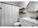 Clean bathroom showcasing a vanity, modern lighting, and shelving for storage at 10551 Huckleberry Ct, Noblesville, IN 46060