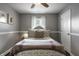 Cozy bedroom with tufted headboard, soft pillows, natural light, and decorative trim at 10551 Huckleberry Ct, Noblesville, IN 46060