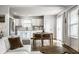 A modern kitchen featuring white cabinets, stainless steel appliances, butcher block countertops, and a rustic wood dining table at 10551 Huckleberry Ct, Noblesville, IN 46060