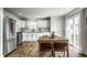 Bright kitchen features stainless steel appliances, white cabinets, butcher block countertops, and a cozy dining table at 10551 Huckleberry Ct, Noblesville, IN 46060