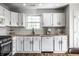 The kitchen features white cabinets, butcher block countertops, a subway tile backsplash, and stainless steel appliances at 10551 Huckleberry Ct, Noblesville, IN 46060
