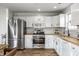 Updated kitchen with stainless steel appliances, butcher block counters, white subway tile, and bright natural light at 10551 Huckleberry Ct, Noblesville, IN 46060