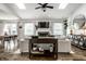 A bright living room featuring a fireplace, skylights, and sleek furniture at 10551 Huckleberry Ct, Noblesville, IN 46060