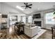 Bright open living room with skylight, fireplace, and modern kitchen with butcher block counters at 10551 Huckleberry Ct, Noblesville, IN 46060