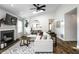 Bright living room with a fireplace, skylight, and modern furnishings at 10551 Huckleberry Ct, Noblesville, IN 46060