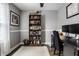 Functional home office setup with a large desk, bookshelf, and natural light at 10551 Huckleberry Ct, Noblesville, IN 46060