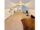 Finished attic featuring carpet, two beds, and white dressers at 106 S Denny St, Indianapolis, IN 46201