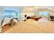 Spacious finished attic featuring bedroom areas, carpet, desk, and windows at 106 S Denny St, Indianapolis, IN 46201