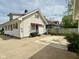 View of the house, concrete patio area and a grassy area at 106 S Denny St, Indianapolis, IN 46201