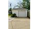 Detached single-car garage with white siding and a concrete driveway at 106 S Denny St, Indianapolis, IN 46201