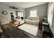 Cozy living room with hardwood floors, neutral walls, and comfortable seating at 106 S Denny St, Indianapolis, IN 46201