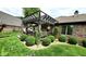 Outdoor living space with pergola, deck, and manicured landscaping, great for entertaining at 1102 Redwood Dr, Brownsburg, IN 46112