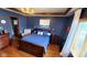 Cozy main bedroom with tray ceiling, wood trim, and recessed lighting at 1102 Redwood Dr, Brownsburg, IN 46112