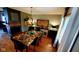 Dining room featuring a modern chandelier, statement table with seating, and elegant decor at 1102 Redwood Dr, Brownsburg, IN 46112