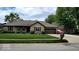Charming brick home featuring a well-manicured lawn and an attached two-car garage with a beautiful roof at 1102 Redwood Dr, Brownsburg, IN 46112