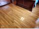 Close up of beautiful hardwood flooring with cherry finish, showcasing durability and classic design at 1102 Redwood Dr, Brownsburg, IN 46112