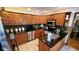 Well-lit kitchen with oak cabinets, granite countertops, stainless steel appliances, and center island at 1102 Redwood Dr, Brownsburg, IN 46112