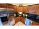 Kitchen featuring oak cabinets, granite countertops, and stainless steel appliances at 1102 Redwood Dr, Brownsburg, IN 46112